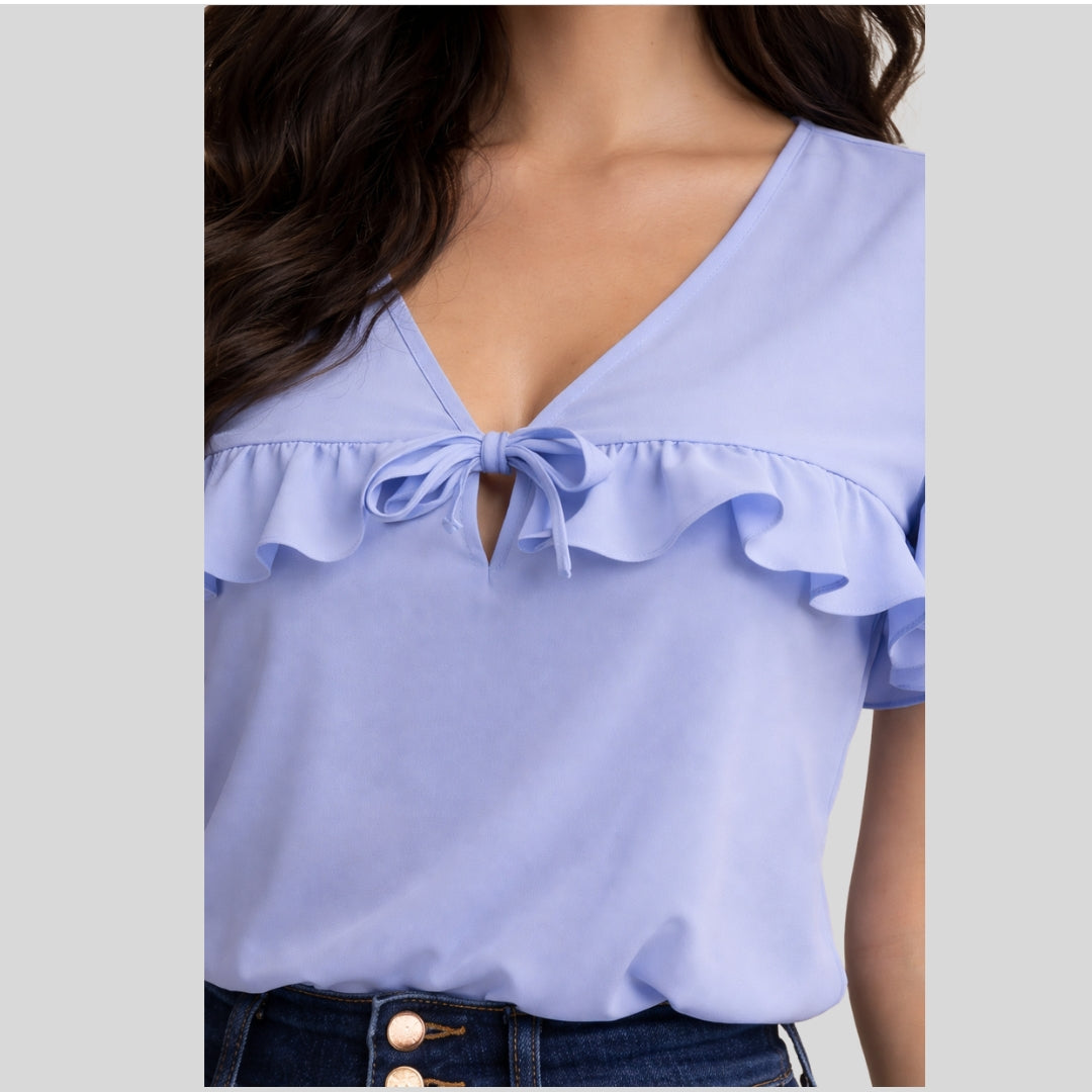 Blusa con lazo y detalles de boleros